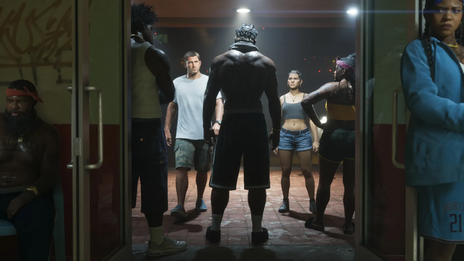 Official GTA 6 screenshot — a night courtyard lit only by ceiling lamps and light spilling through glass doors (An Extended Look)